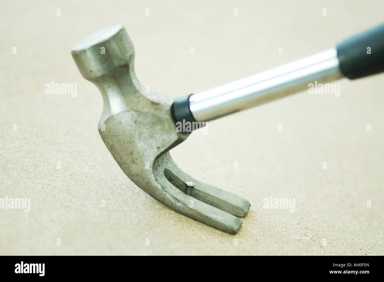 Hammer removing nail, close-up Stock Photo