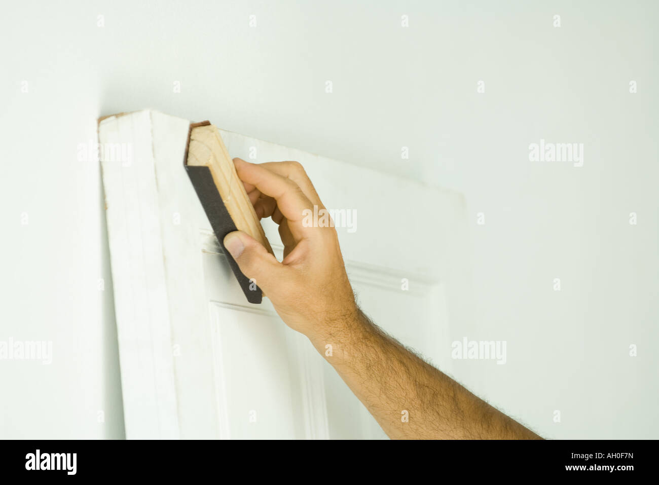 Man sanding door, cropped view of hand Stock Photo Alamy