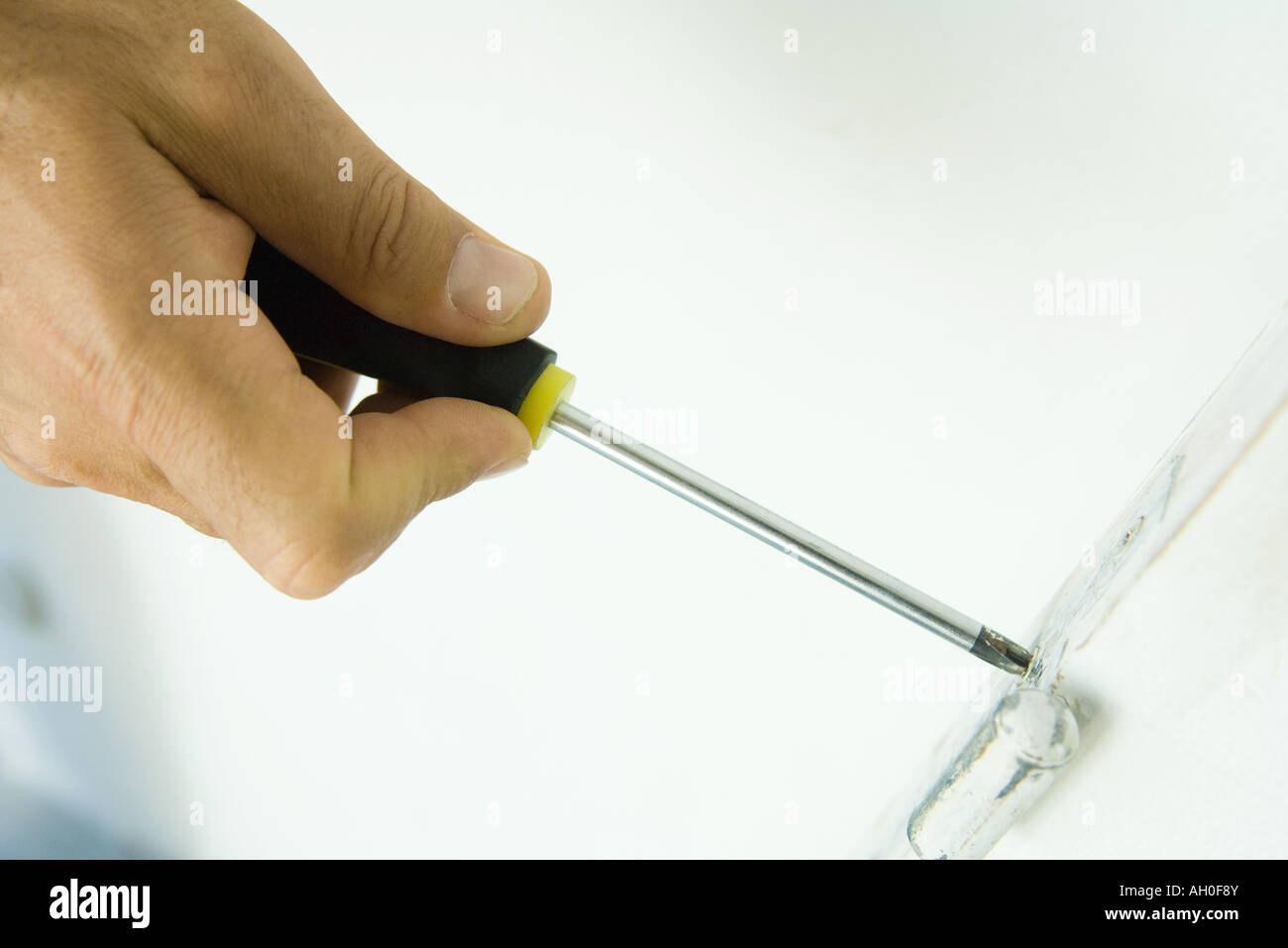Man using screwdriver, cropped view of hand Stock Photo - Alamy
