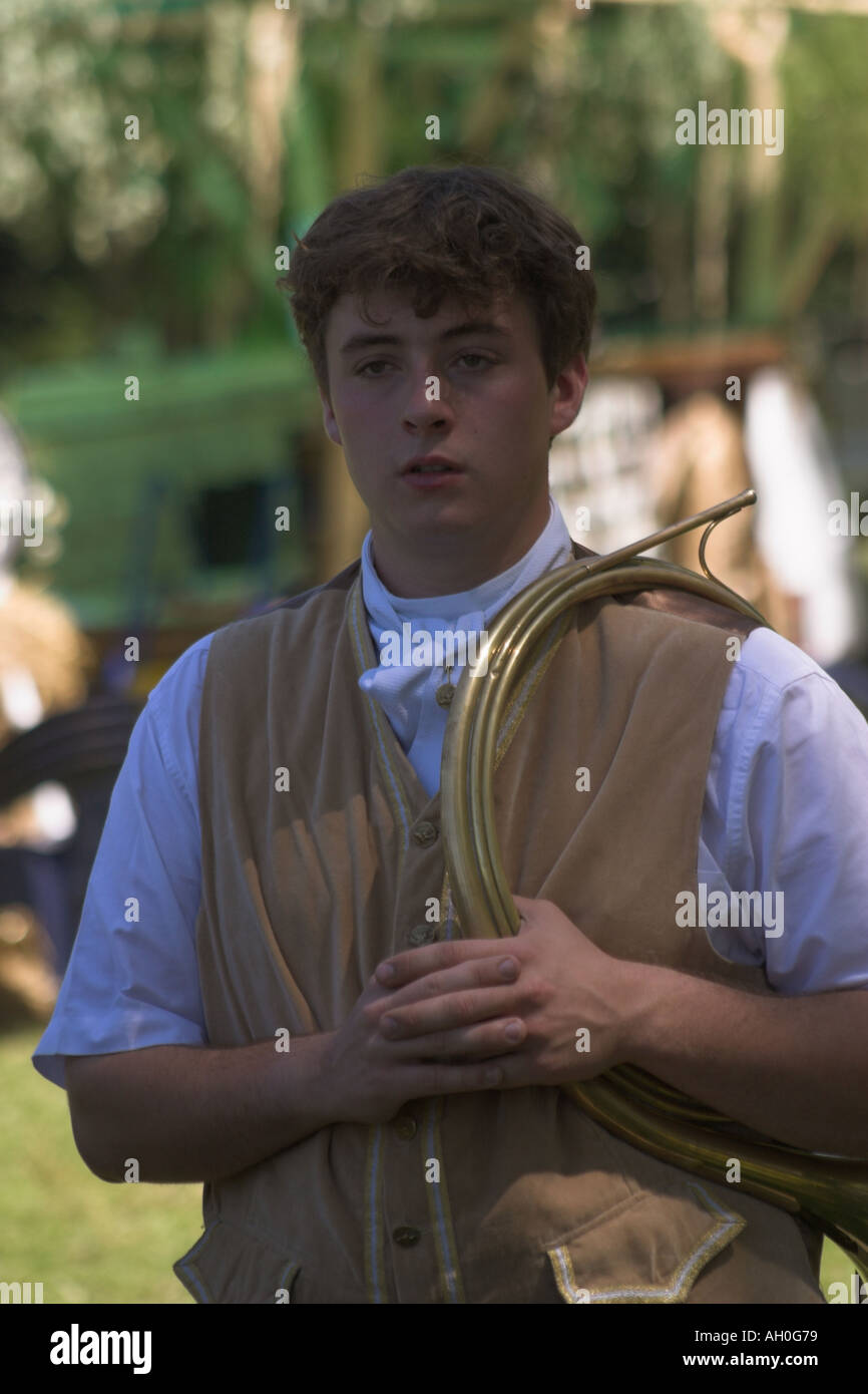 Young male with french horn at attelage Aubrometz Pas de Calais Stock