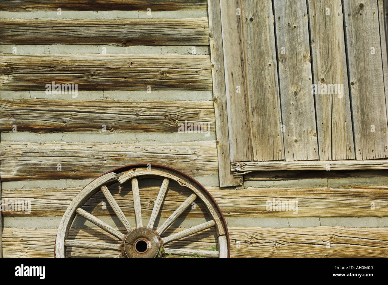 wagon wheel outside log cabin cody wild west town wyoming usa united