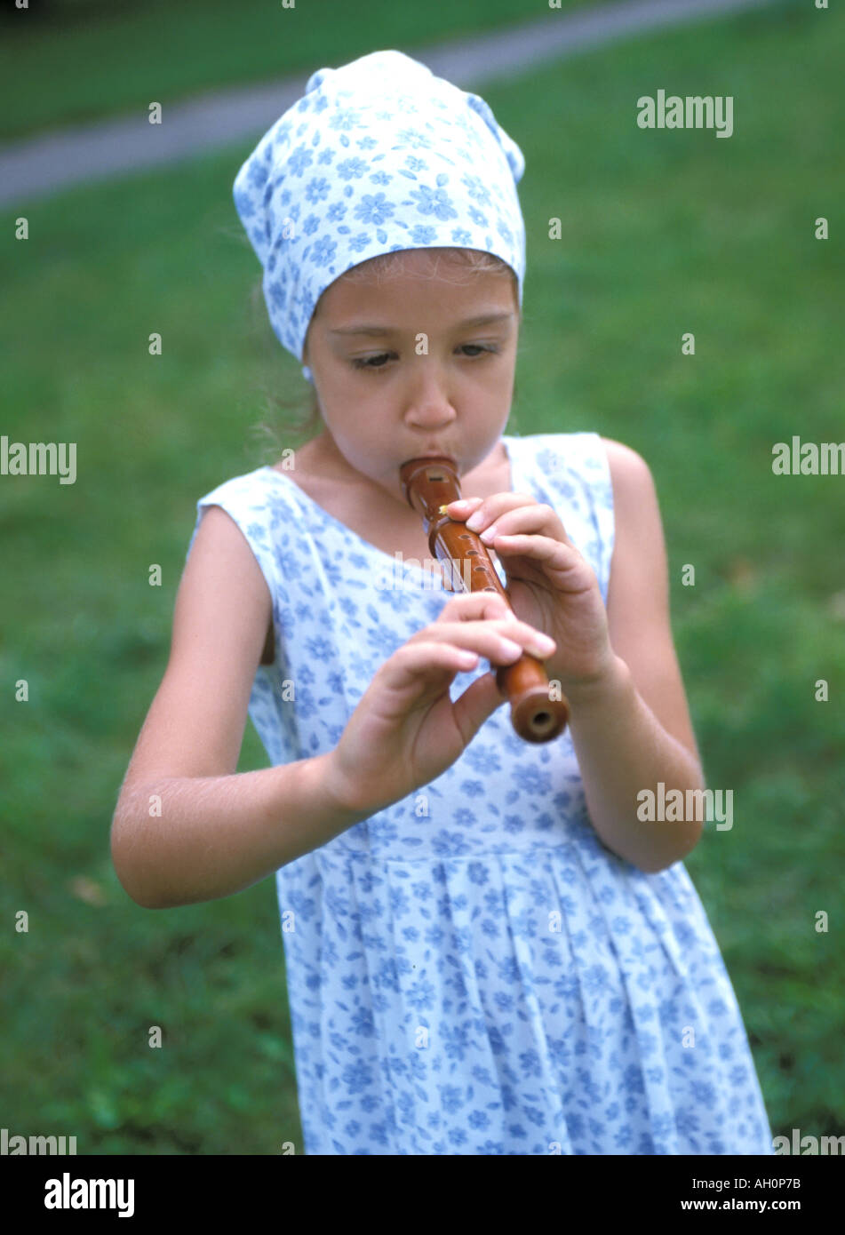 girl playing flute Stock Photo