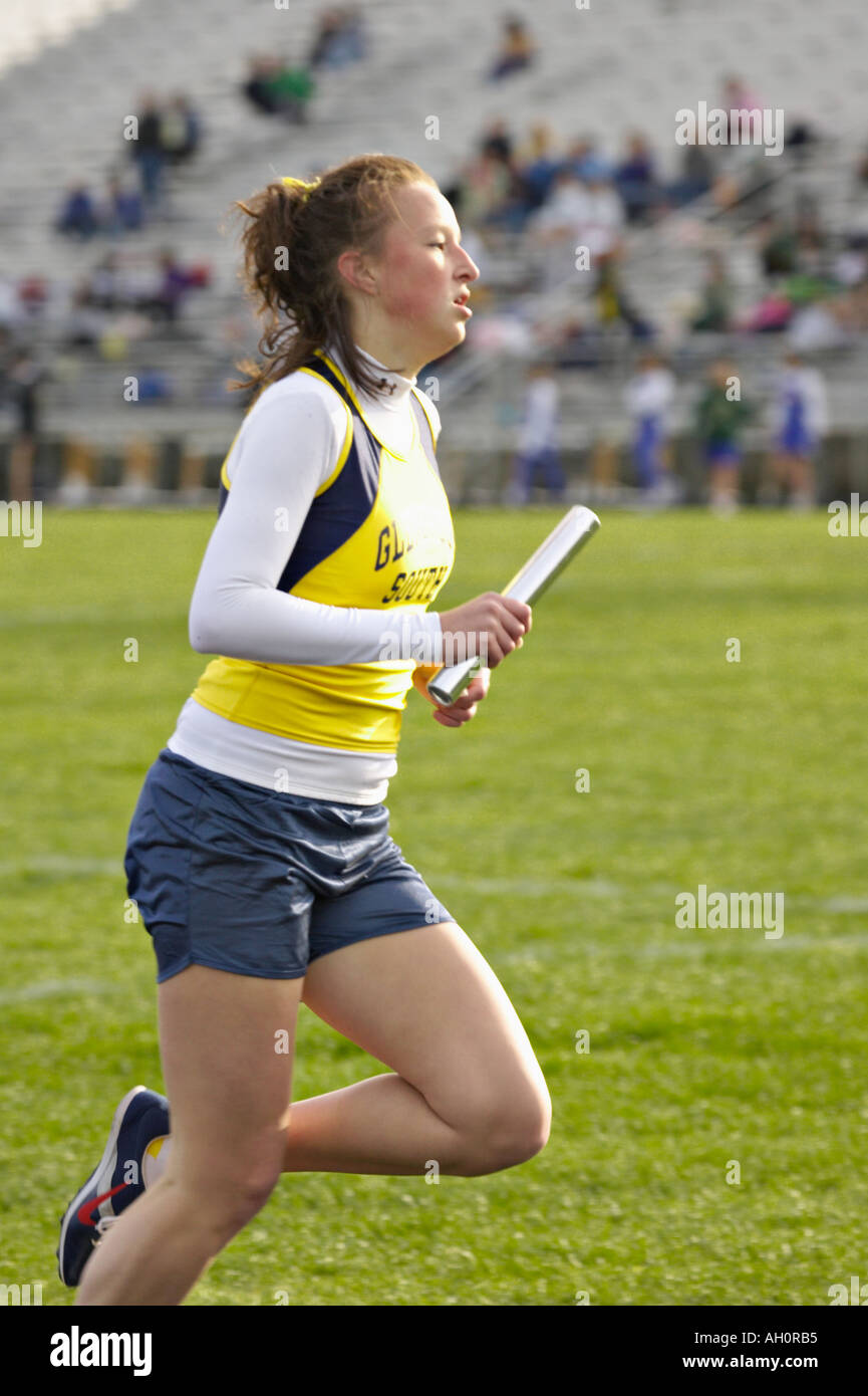 TRACK Glenview Illinois Female runner with baton 800 meter relay team
