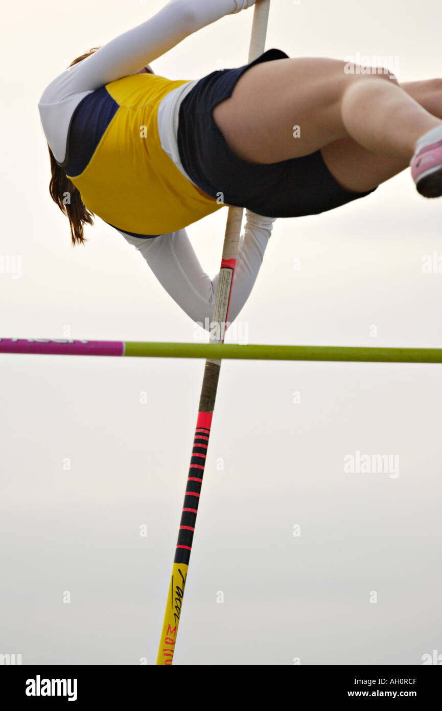 TRACK Glenview Illinois Female pole vaulter clear high bar push away