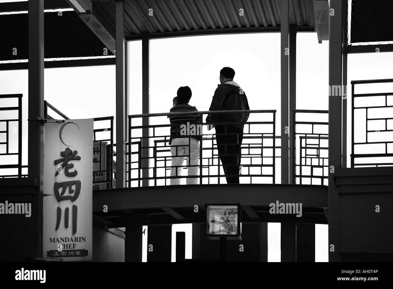 a couple with a child in a shopping center chinatown chicago illinois Stock Photo