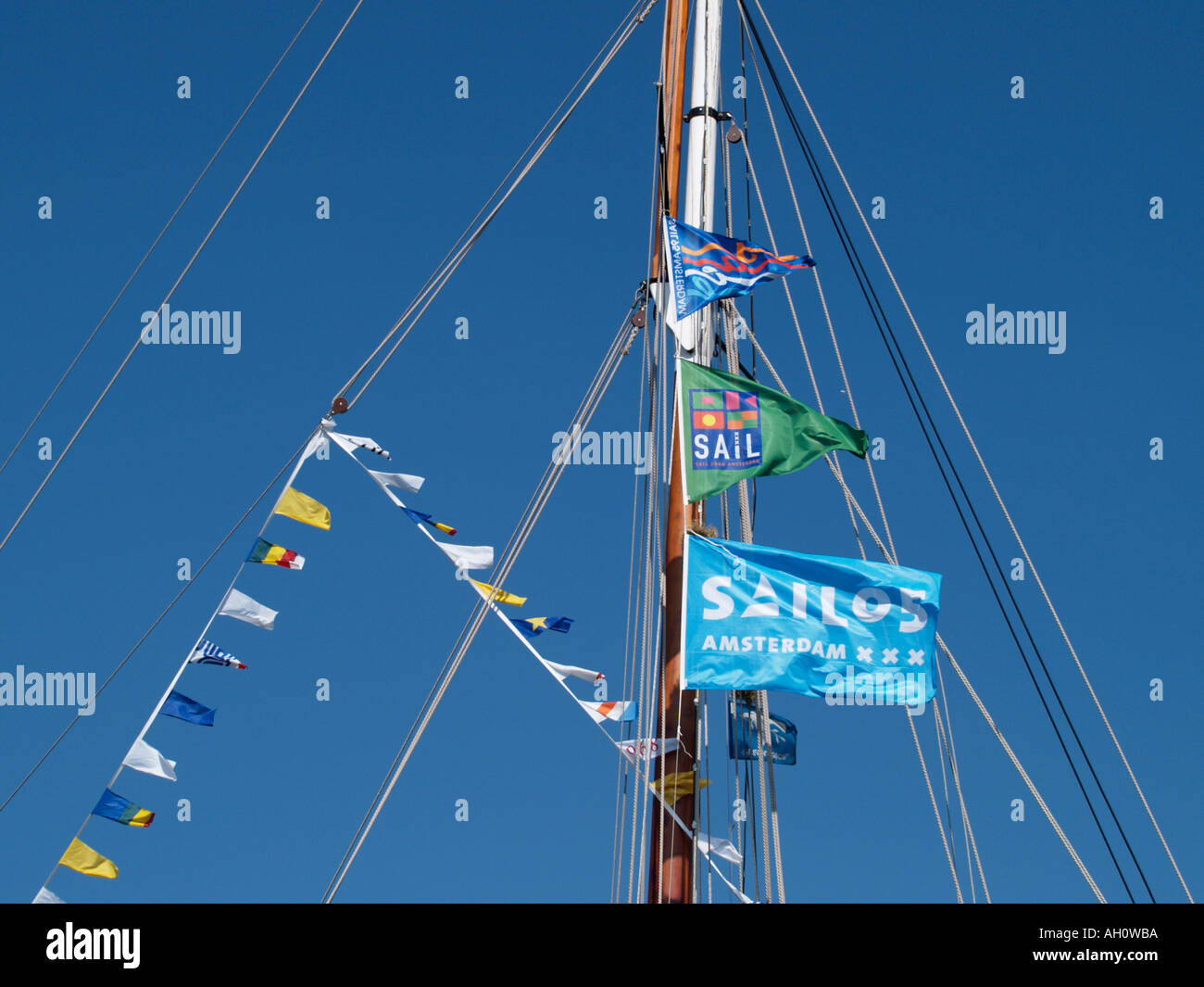 Mast with Sail Amsterdam 2005 tall ship event flags blowing in the wind ...