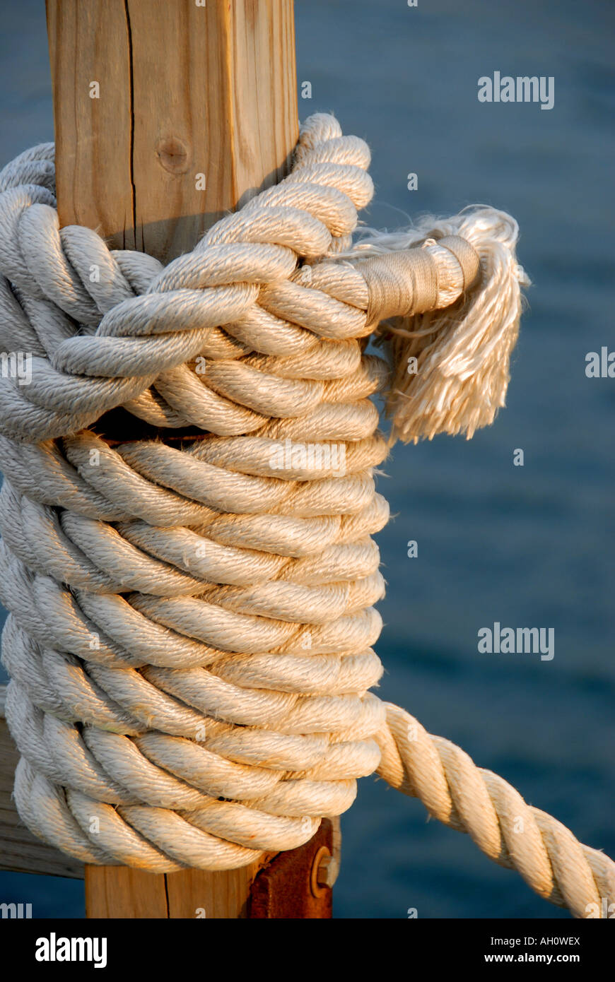 Rope tied carefully at dock to tie up a boat Stock Photo Alamy
