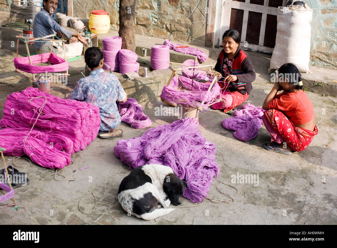 Nepalese people spinning coloured wool. Kathmandu, Nepal Stock Photo