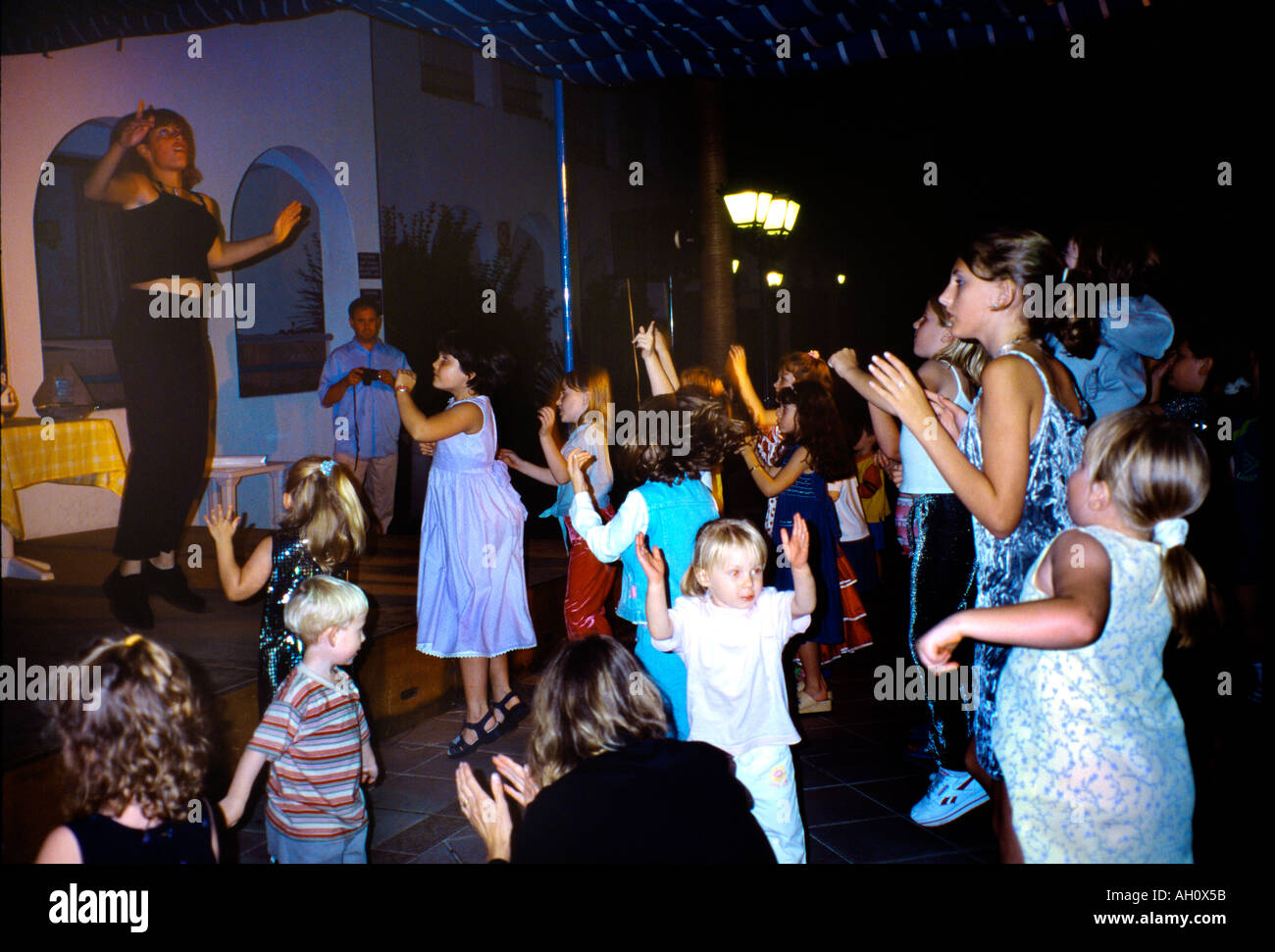 Sant Thomas Menorca Balearic Islands Spain Children Dancing with Holiday Rep At A Mini Disco At Resort Stock Photo