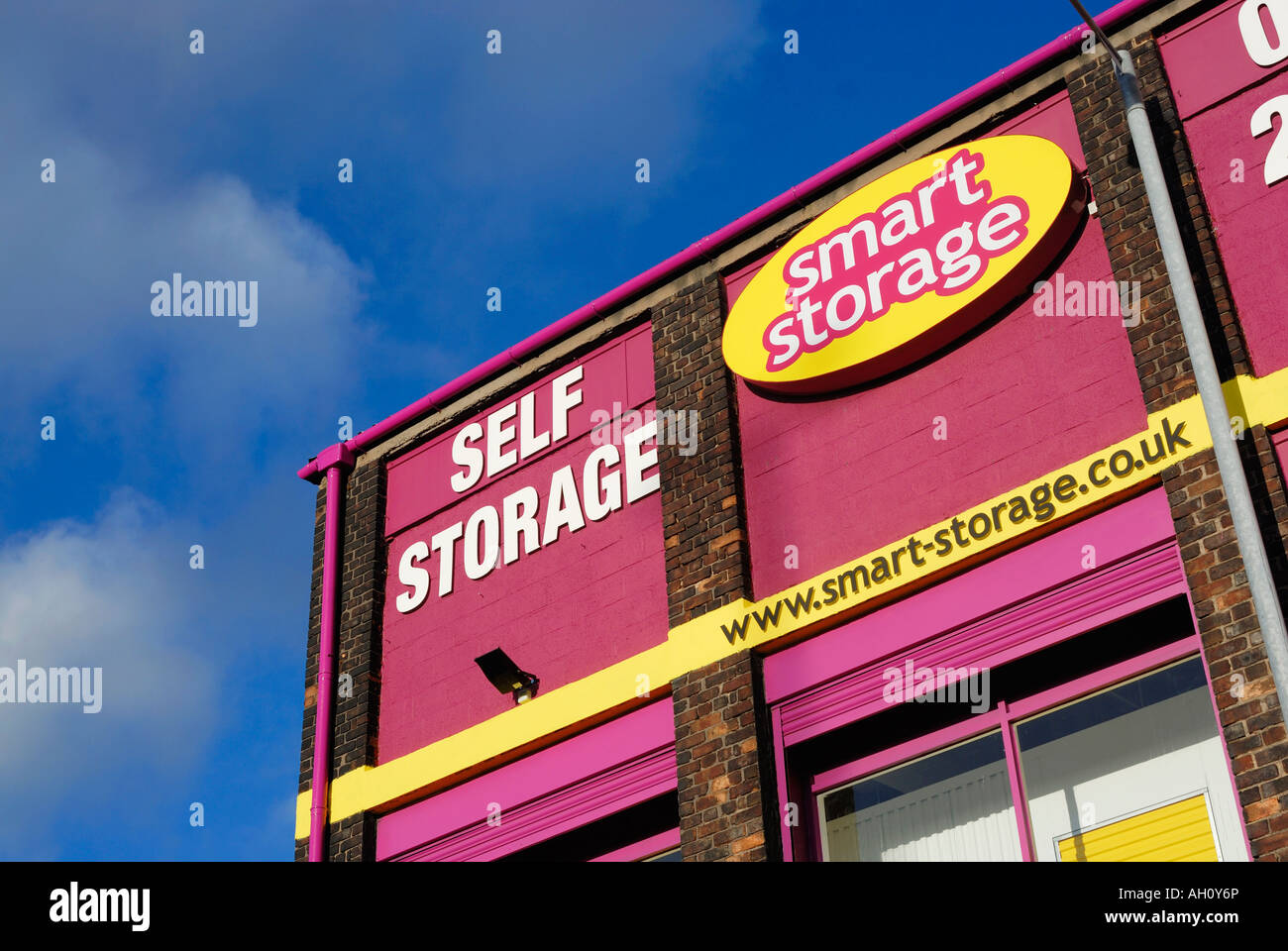Brightly coloured building with signs advertising its storage