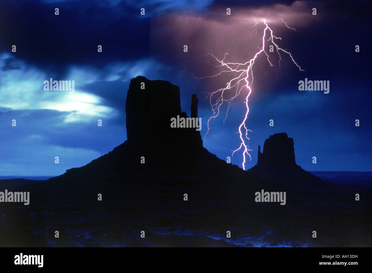 Lightning striking between the Mittens in Monument Valley  Arizona Stock Photo