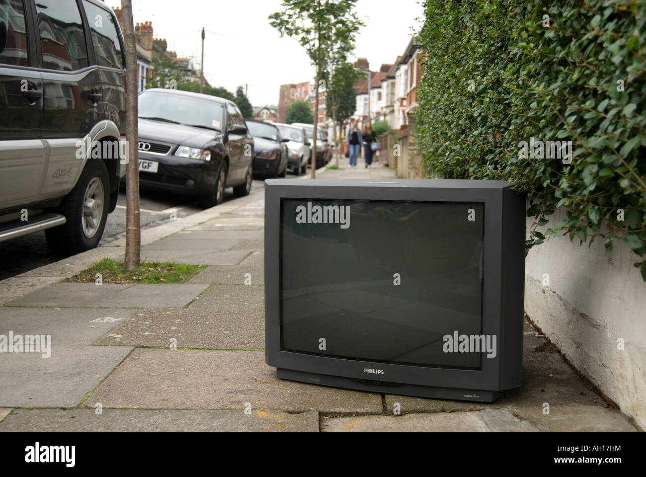 Old television dumped in the street, London, England UK Stock Photo