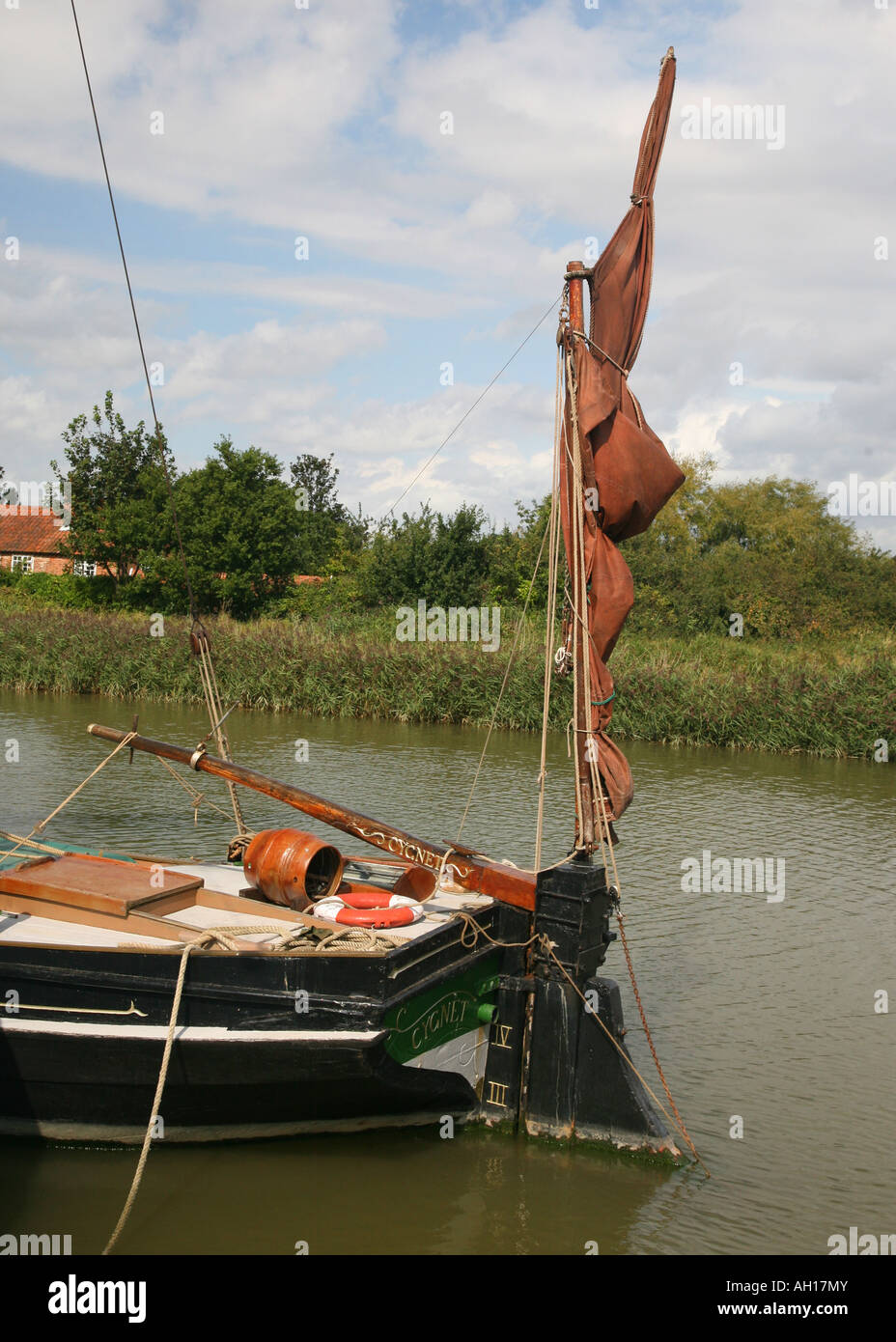Furled mizzen and tiller of an old barge at the Maltings Snape Suffolk Stock Photo