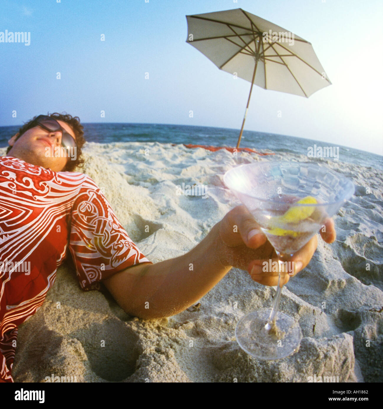 Man drinking martini beach hires stock photography and images Alamy