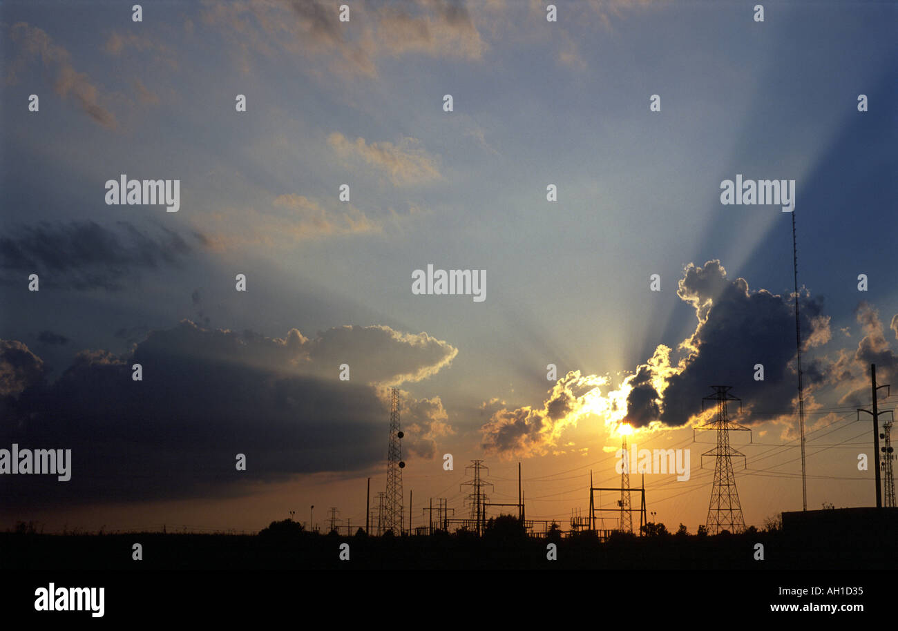 Sunset behind  a group of power towers Stock Photo