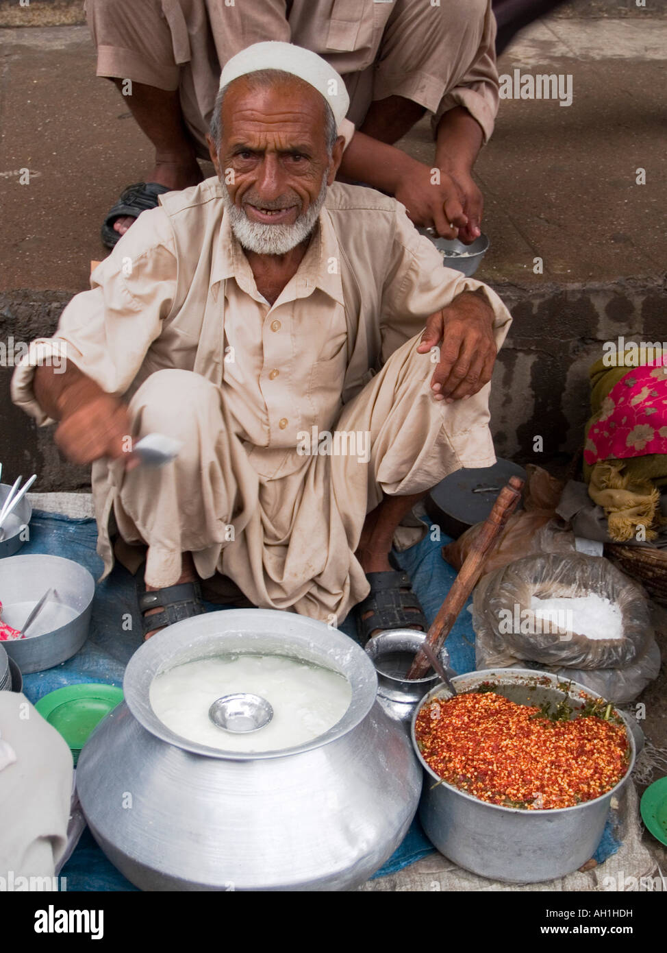 yoghurt vendor in the bazaar of Peshawar Pakistan Stock Photo Alamy
