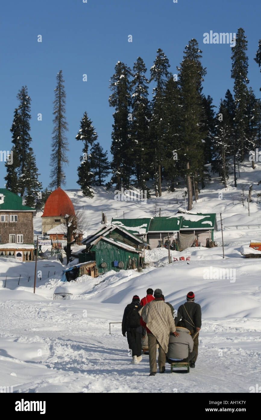 People carrying sleigh , Gulmarg Village , Kashmir , India Stock Photo Alamy