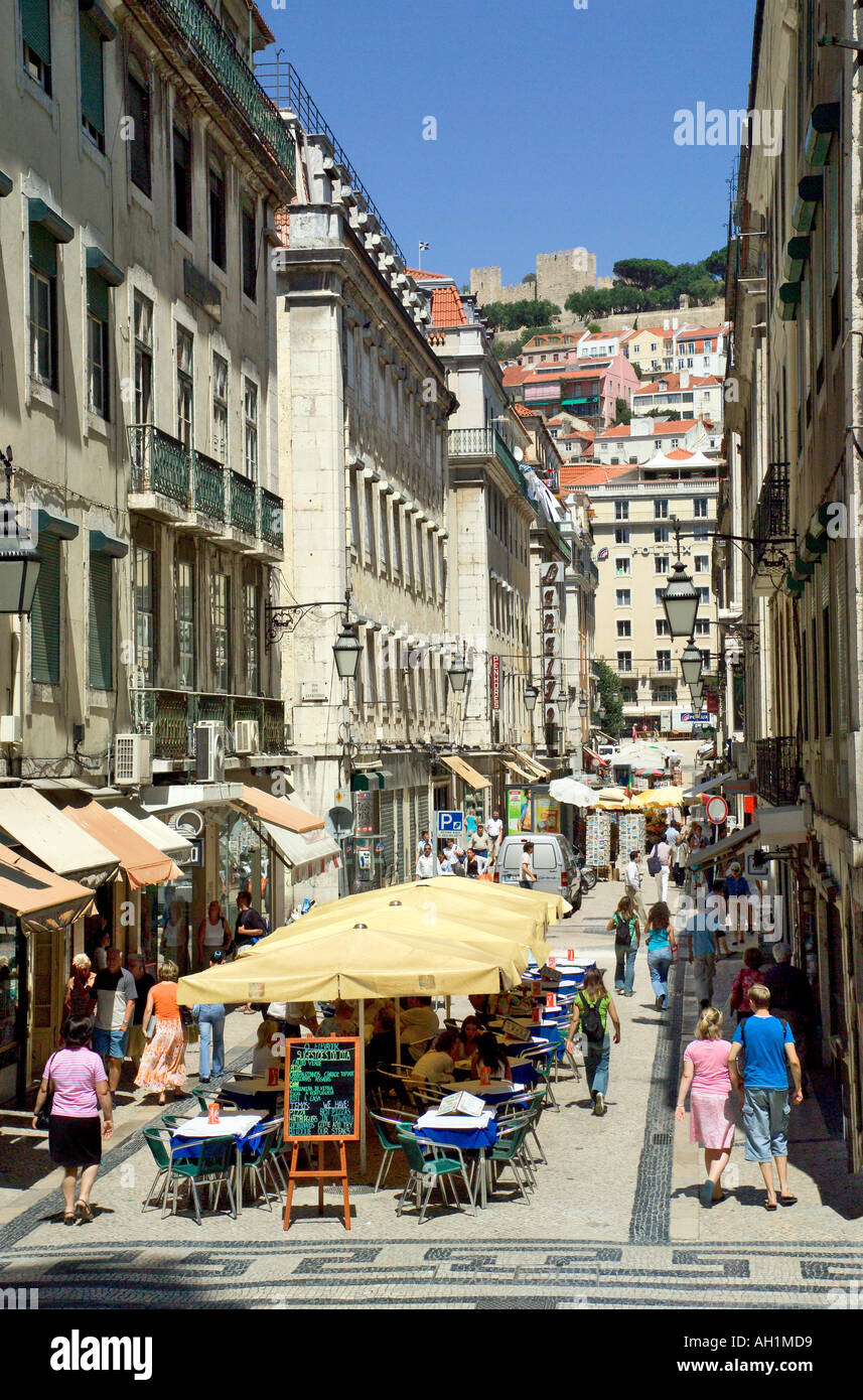 Lisbon Portugal street in the baixa district looking towards the castle of sao jorge Stock Photo