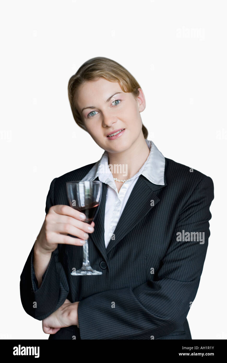 Portrait of a businesswoman holding a glass of red wine Stock Photo - Alamy