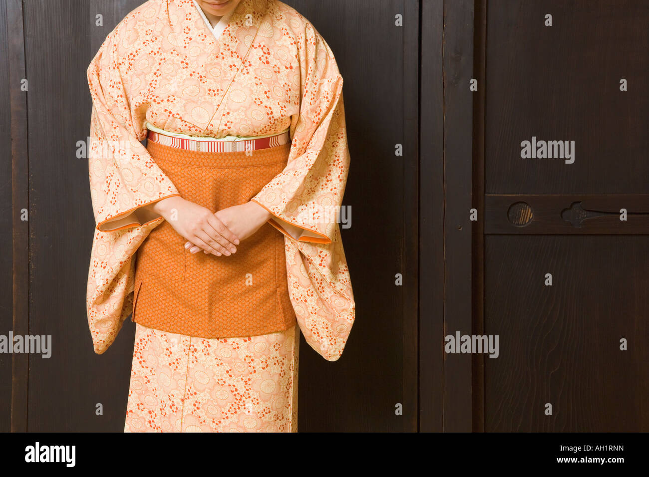 Woman wearing kimono with apron Stock Photo Alamy