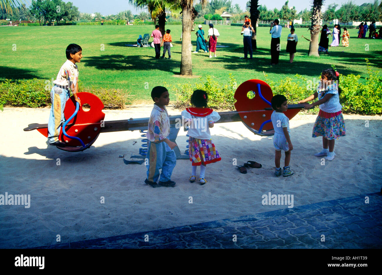 Dubai UAE Safa Park Children On Seesaw Tilting Stock Photo - Alamy