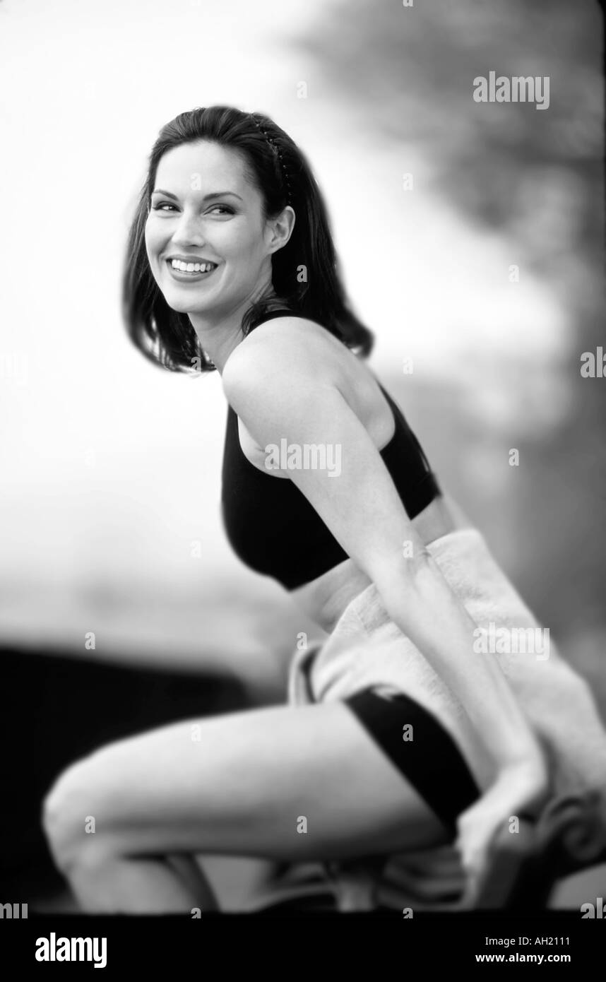 Woman In Workout Clothes Sitting On Bench Stock Photo 1122576 Alamy
