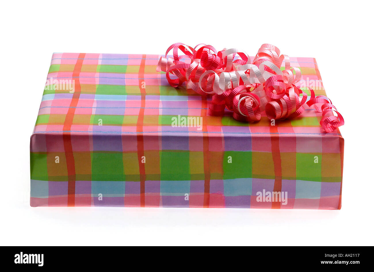 Wrapped present with pink bow silhouetted on white background Stock Photo