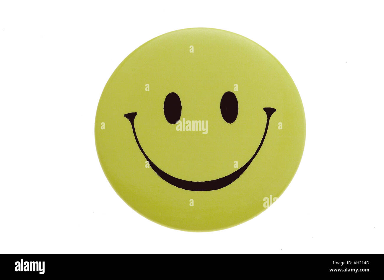 yellow smiley face button silhouetted on white background Stock Photo