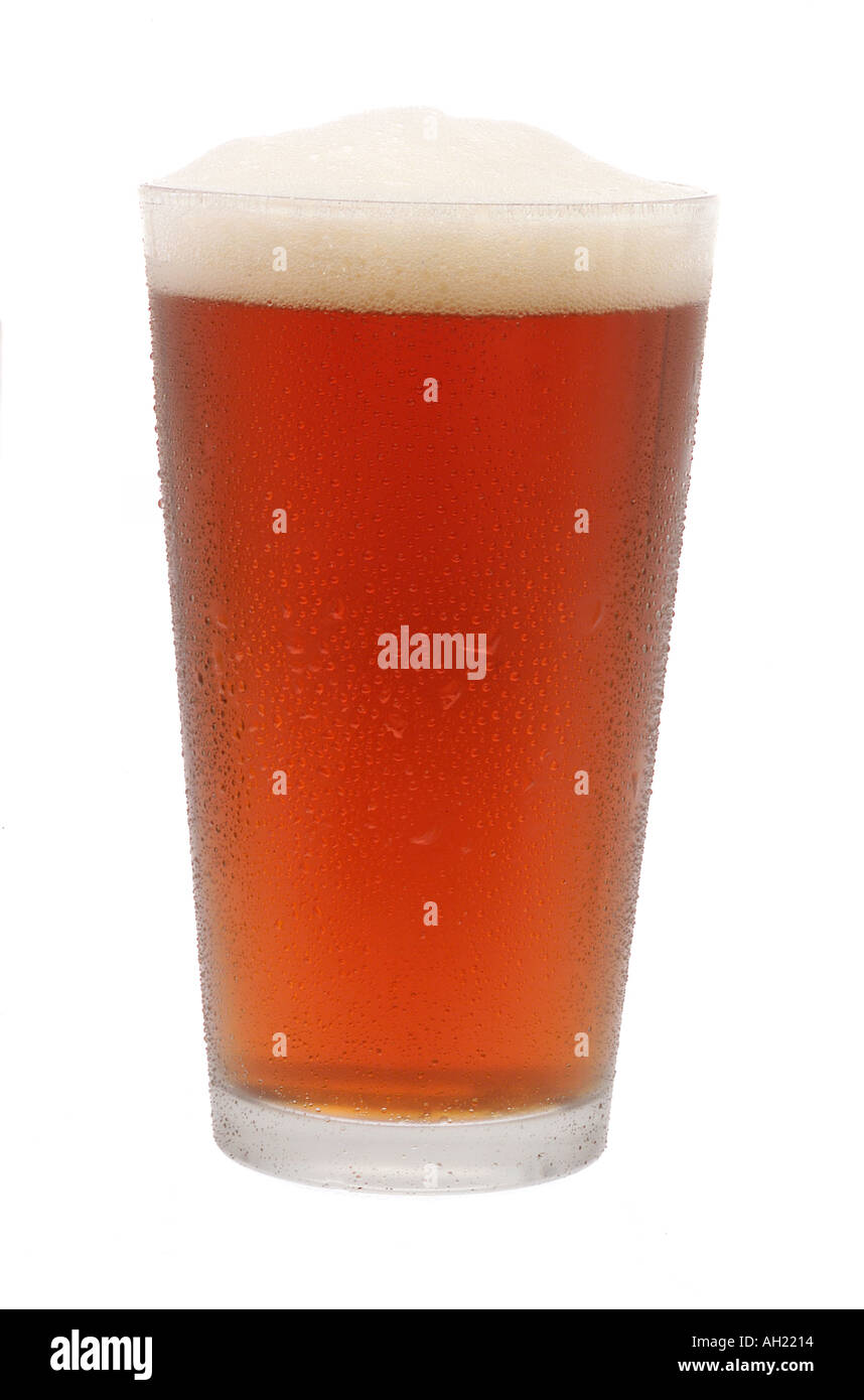 A silhouetted pint of amber beer in frosted glass on white background Stock Photo