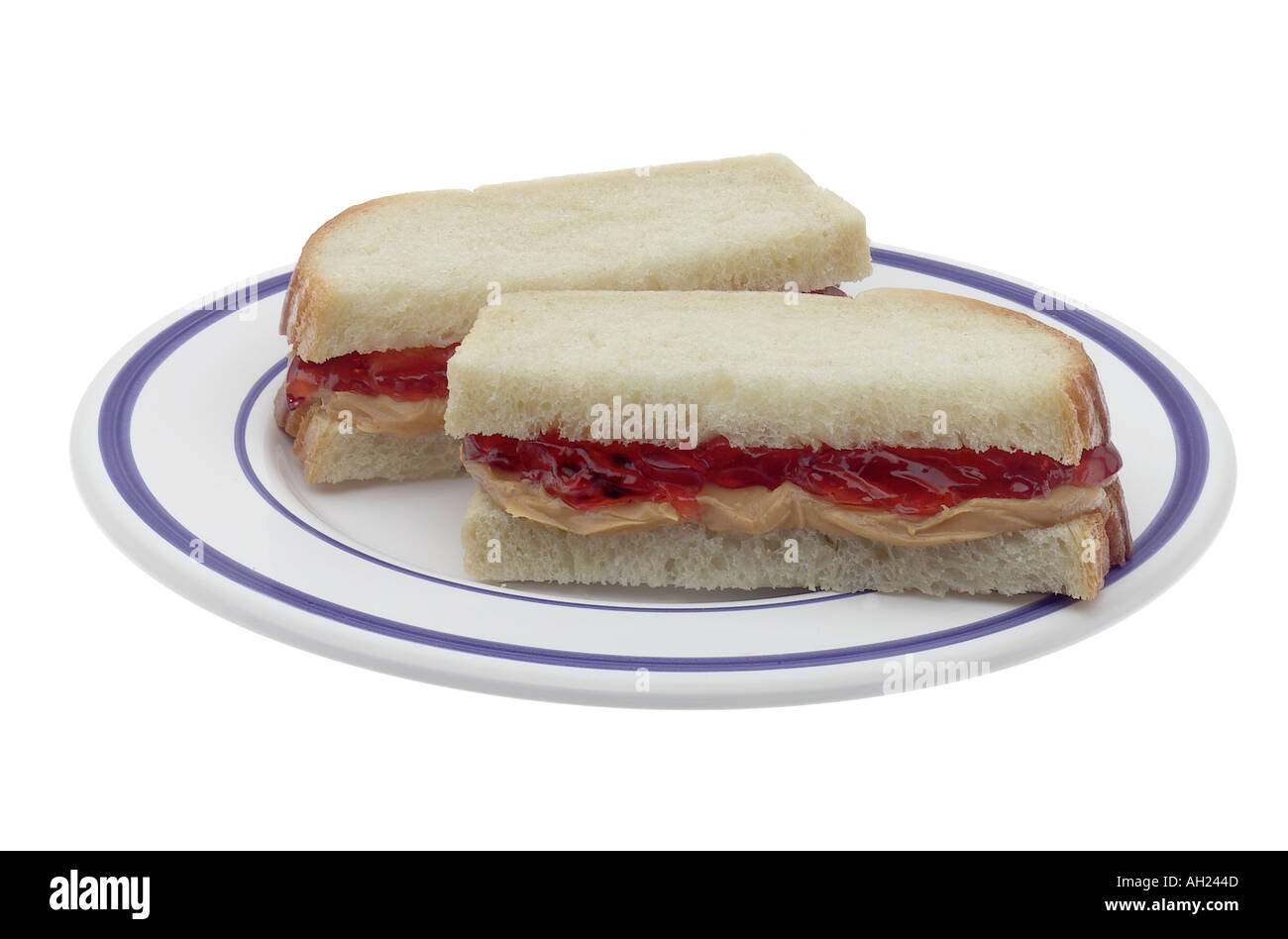 Peanut butter and jelly sandwich on plate silhouetted on white background Stock Photo