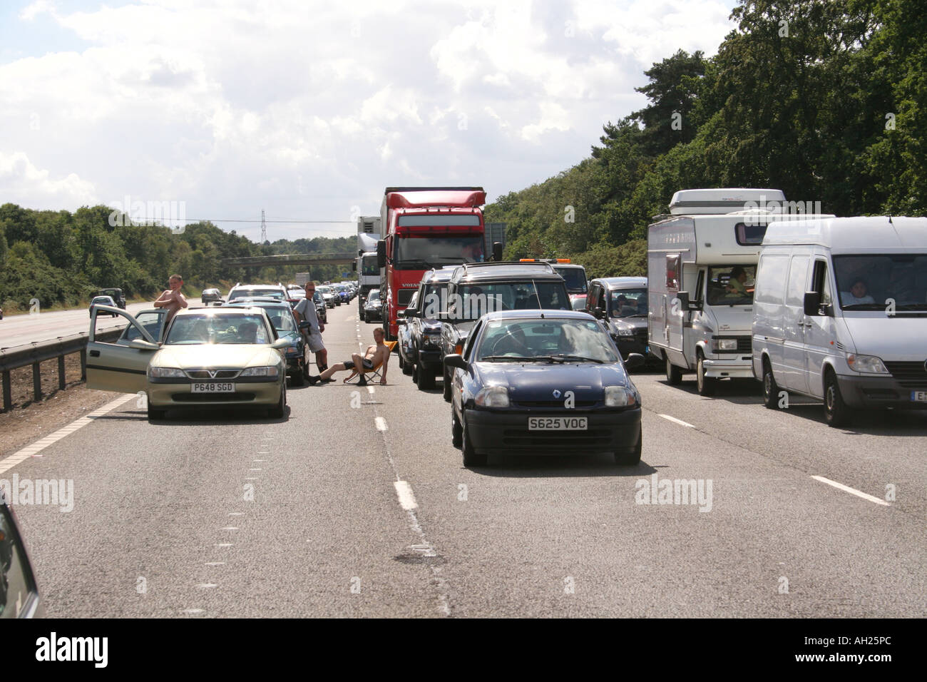 People getting out of their cars after an accident has closed the M3 ...