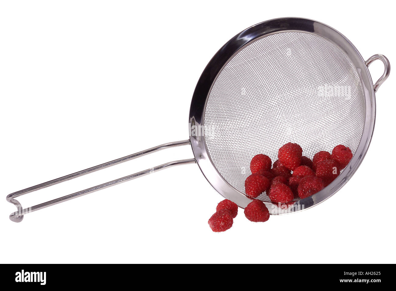 Wire mesh colander with berries silhouetted on white background Stock Photo
