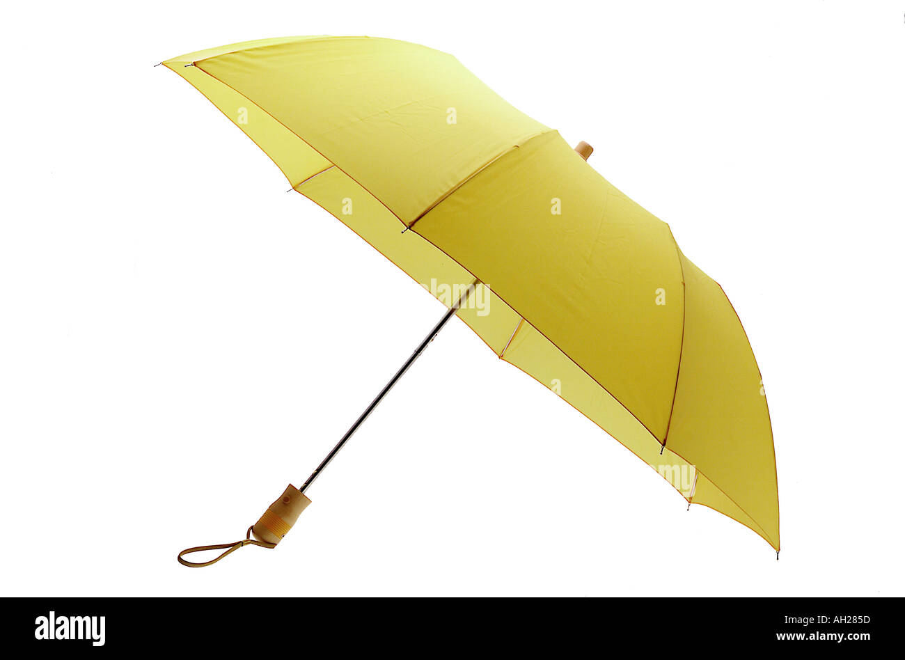 Yellow umbrella silhouetted on a white background Stock Photo - Alamy