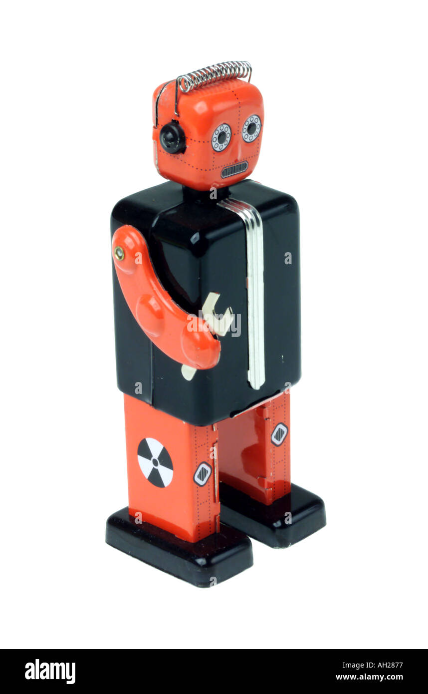 An antique toy metal robot silhouetted on white background Stock Photo