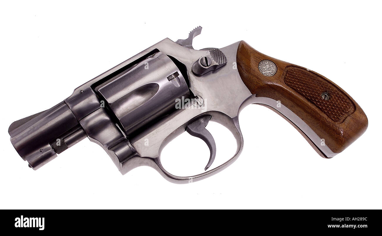 Smith and Wesson 38 detective special snub nose nickel plated hand gun with wooden handle silhouetted on white background Stock Photo
