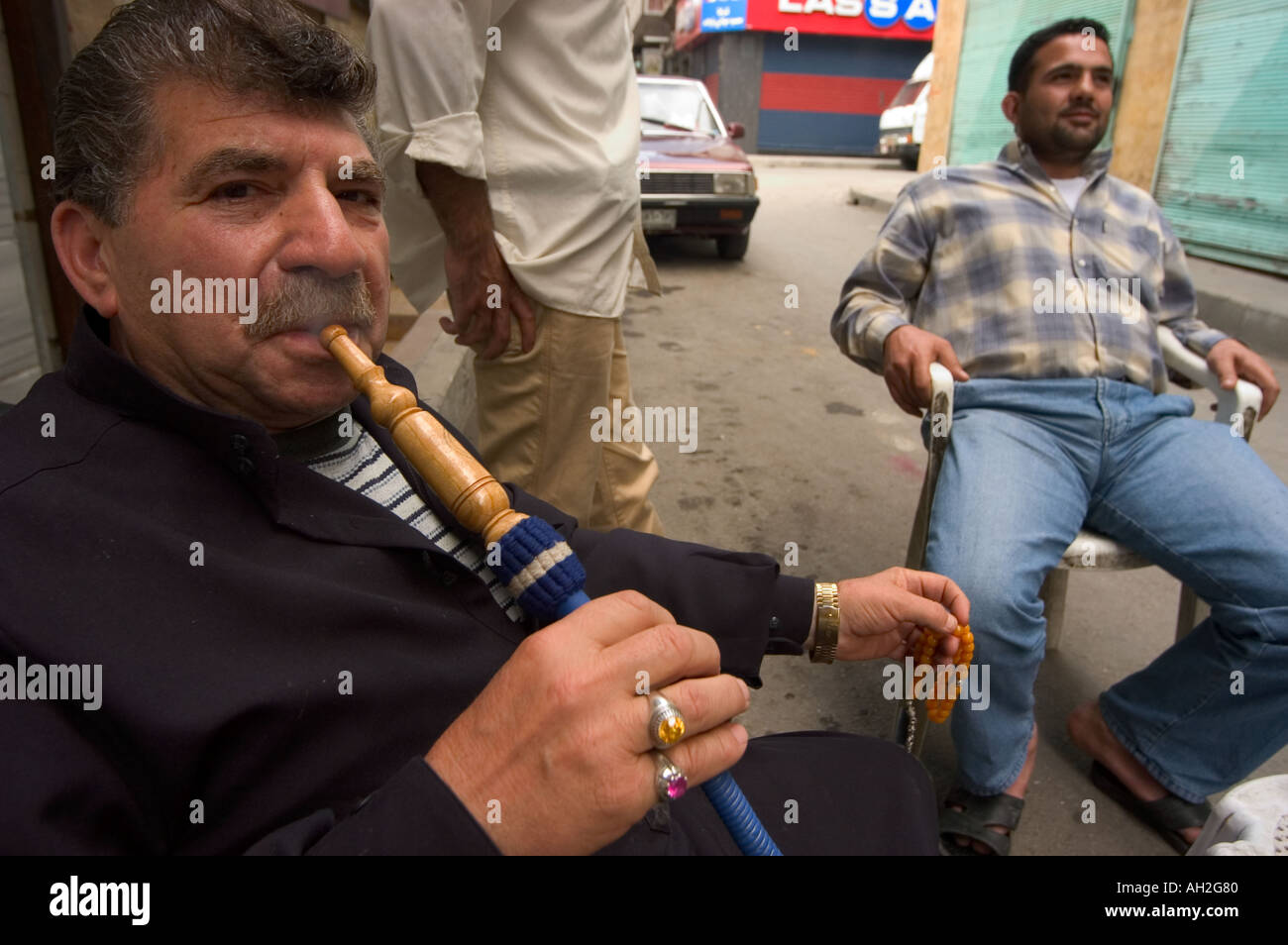 man smoking water pipe Aleppo Haleb Syria Middle East Stock Photo