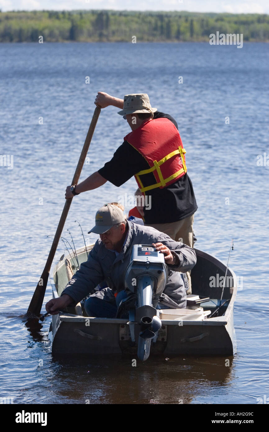Two men paddle away from shore Stock Photo - Alamy