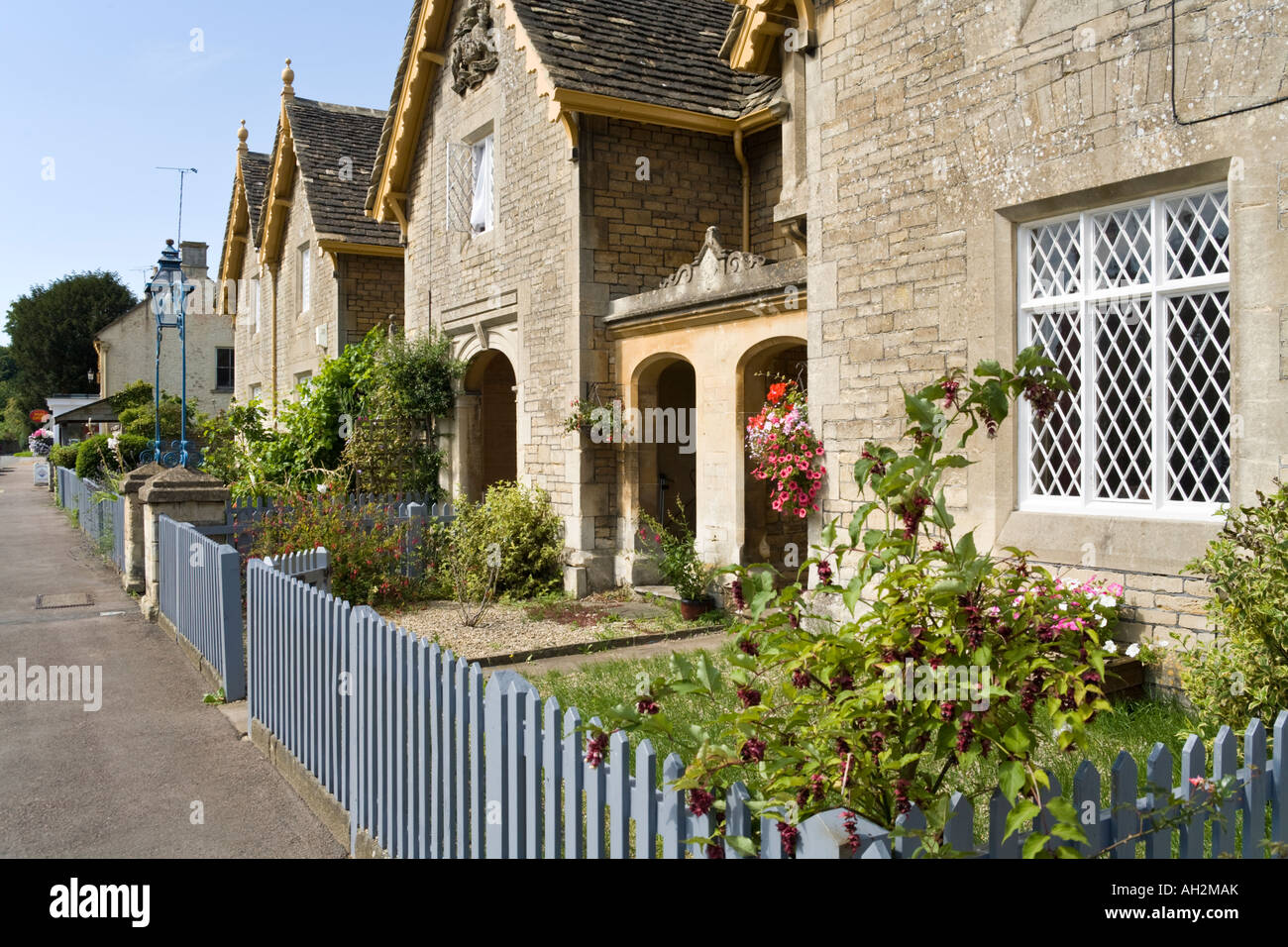 Stone cottages in the Cotswold village of Great Badminton, South