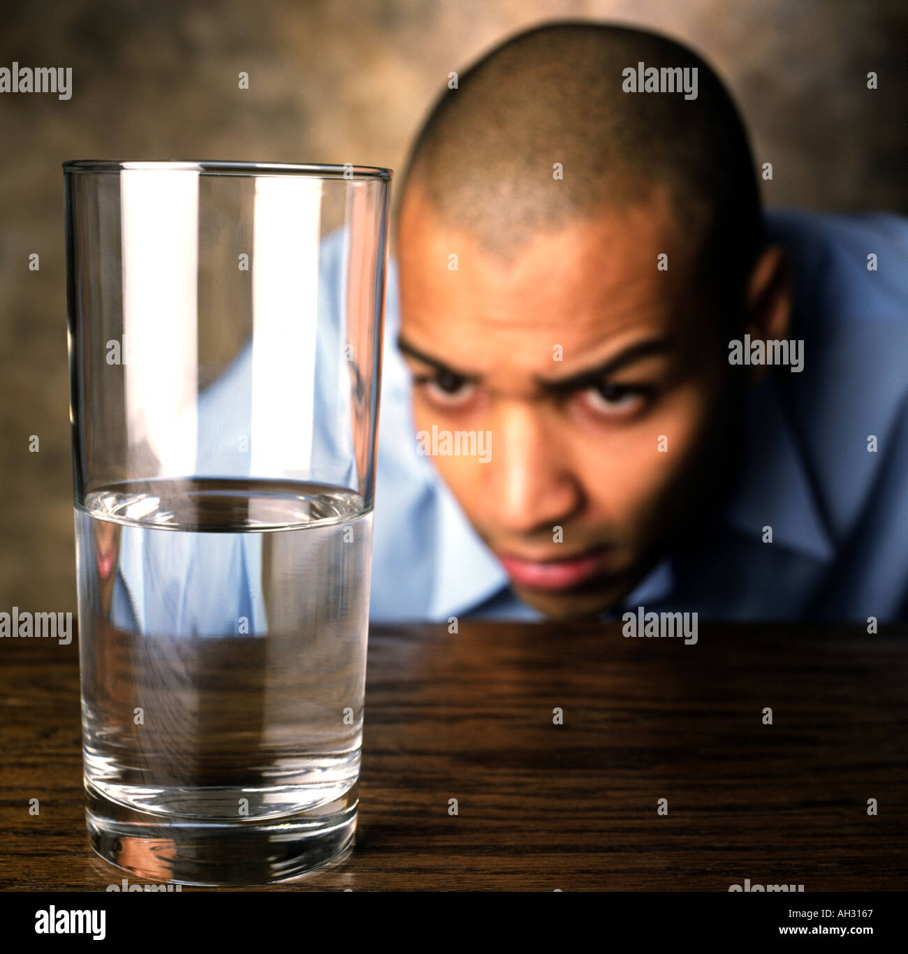 African American Man with glass of water Stock Photo