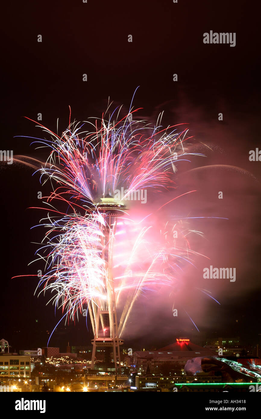 Fireworks launched from the Seattle Space Needle at night in