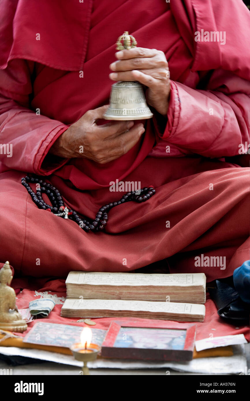 Monks Rining Bells Tibetan buddhist monk ringing bell chanting on street outside Swayambhu ...