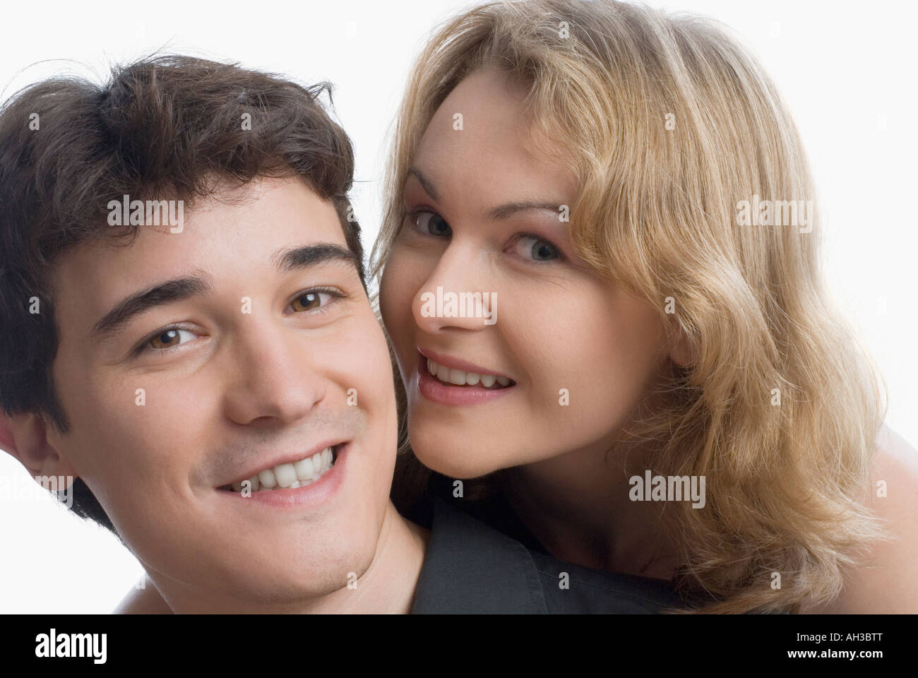 Portrait of a young woman embracing a young man Stock Photo - Alamy