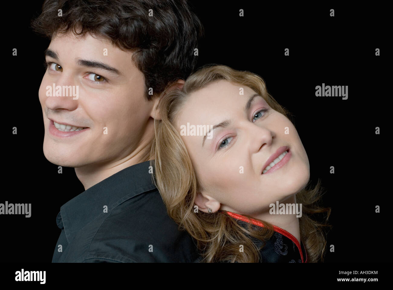 Portrait of a young couple smiling Stock Photo - Alamy