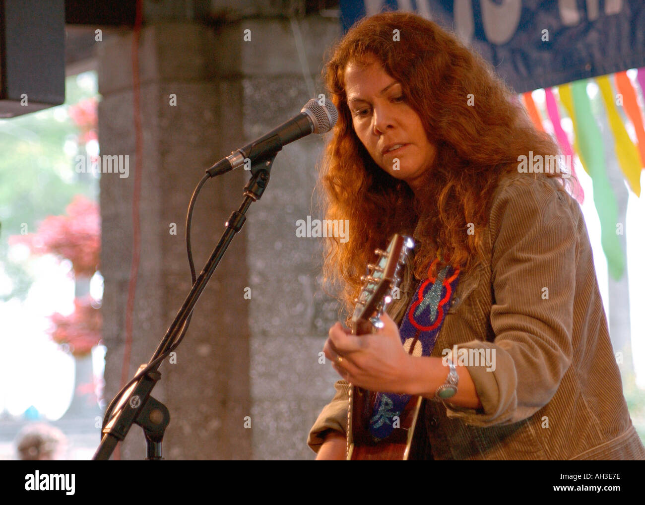 Sultry Female Singer and Guitar Player Rebecca Folson at Outdoor Festival Editorial Use USA Stock Photo