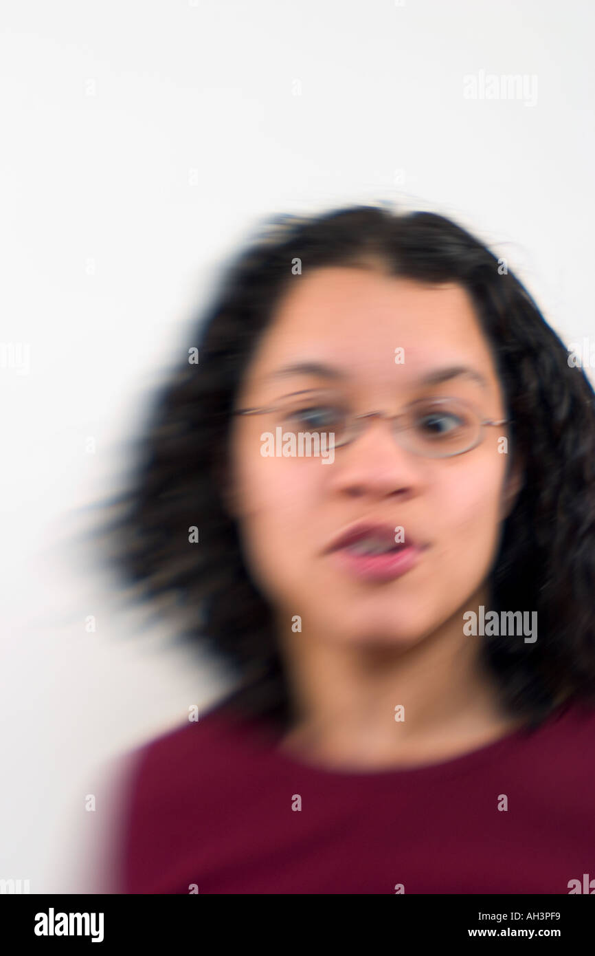 Young Spanish woman wearing glasses posing Model Released Stock Photo