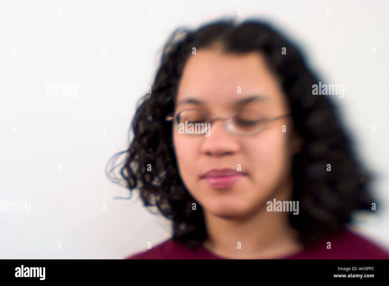 Young Spanish woman wearing glasses posing Model Released Stock Photo