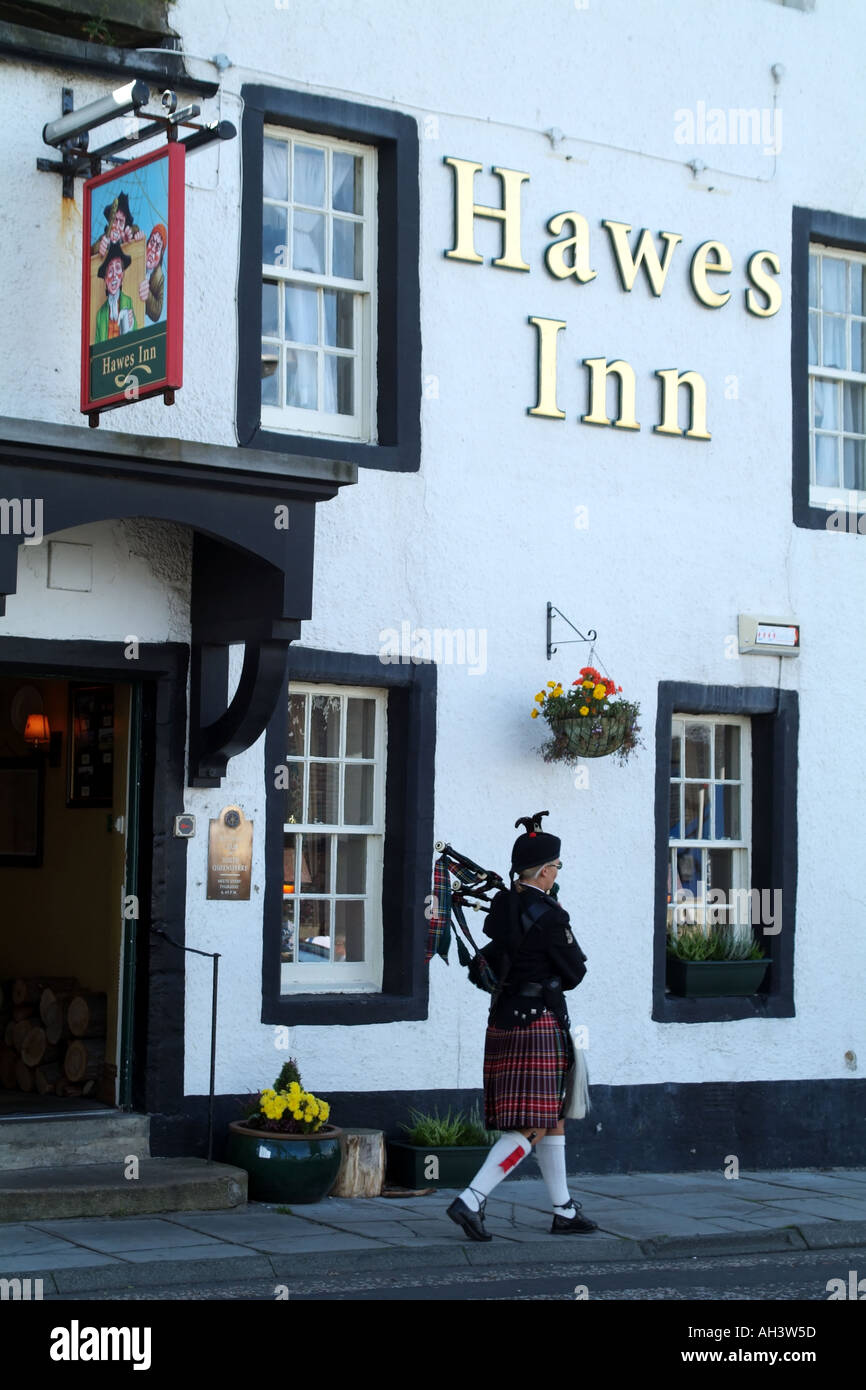 Lone Dano female piper marching The Hawes Inn South Queensferry Scotland UK Europe Stock Photo