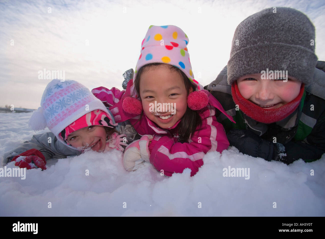 Children playing in the snow Stock Photo - Alamy