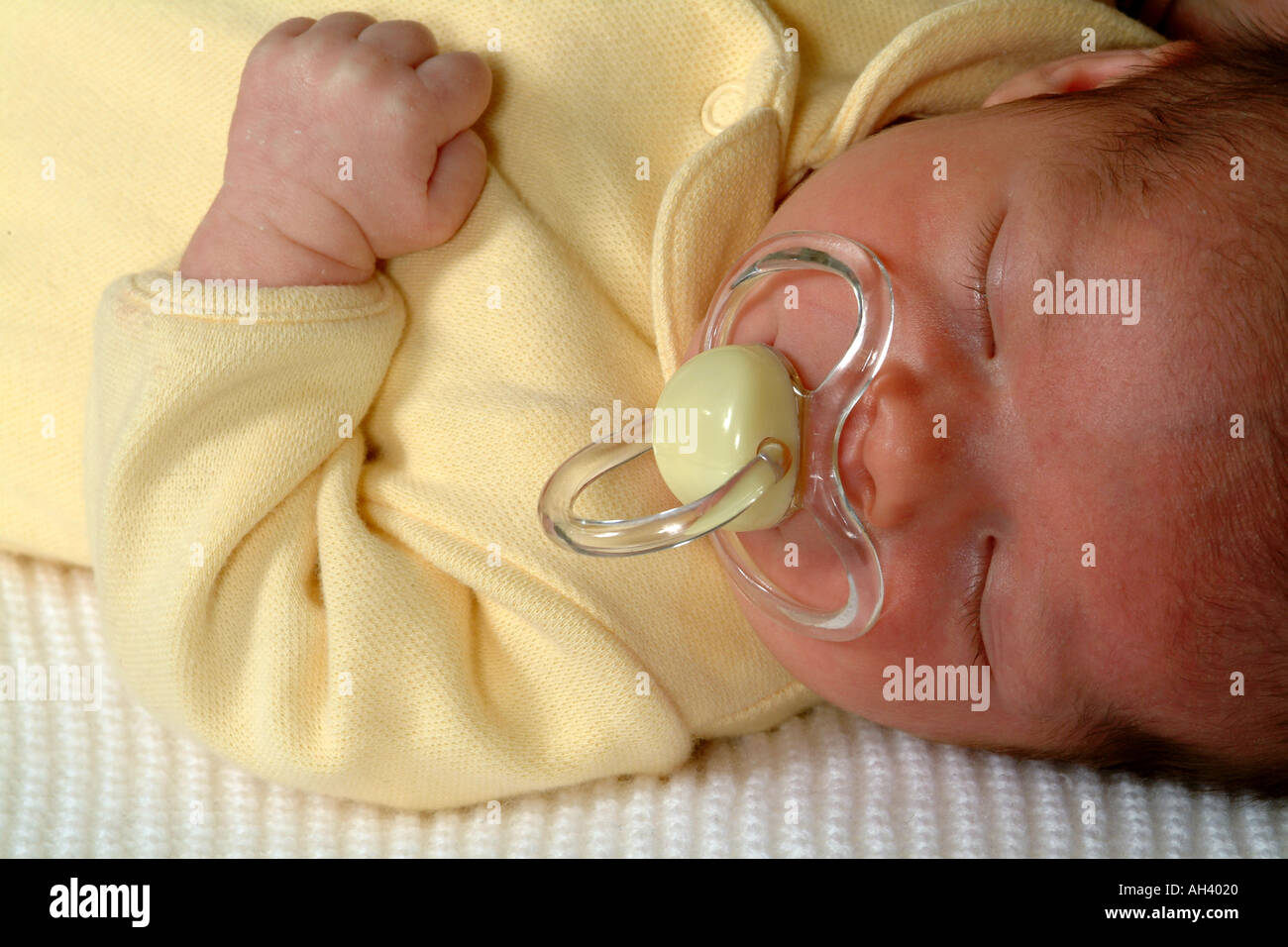 Baby Girl Sleeping With Dummy in Mouth Pacifier Four Weeks Old Stock