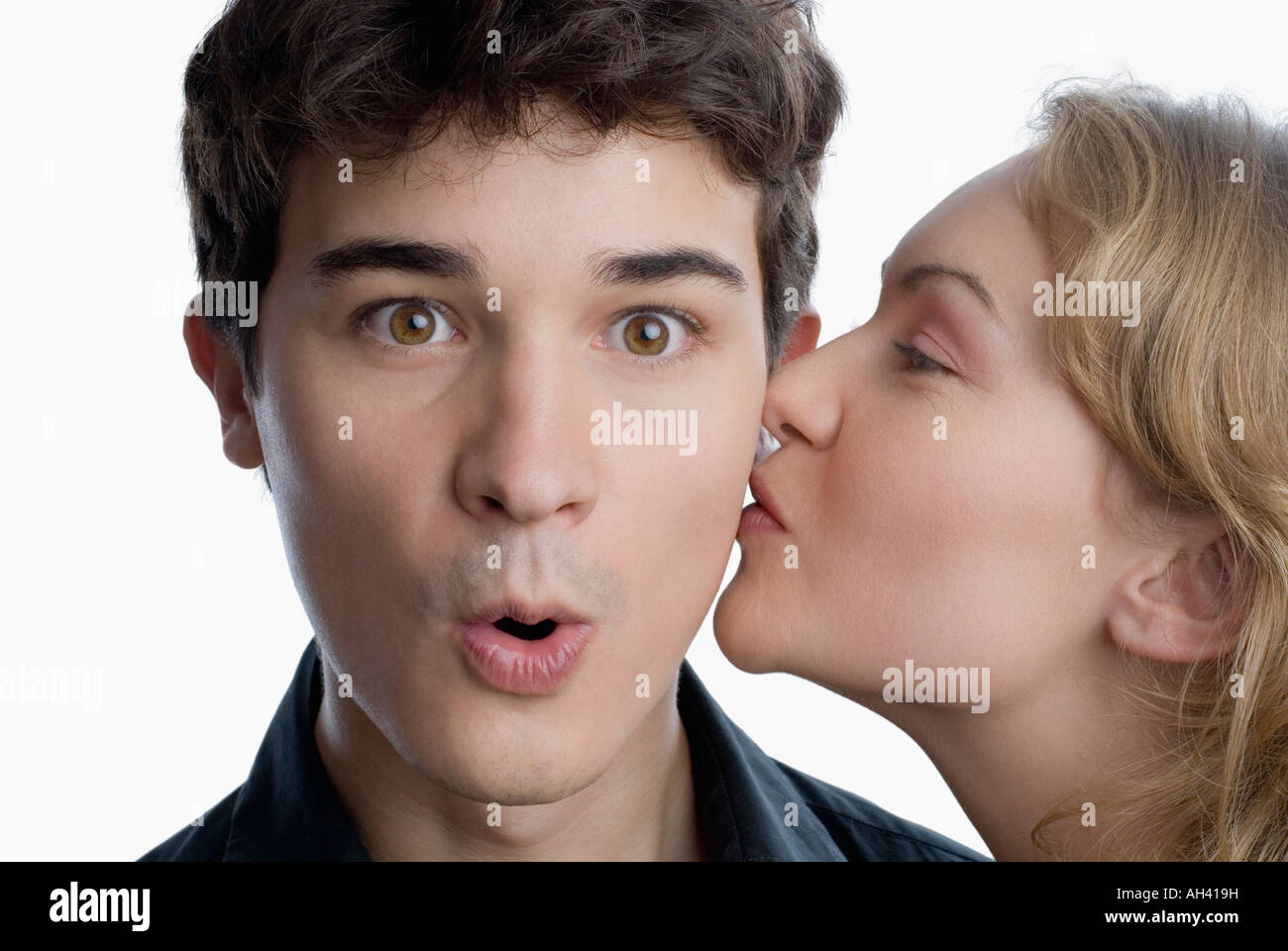 Close-up of a young woman kissing a young man Stock Photo - Alamy